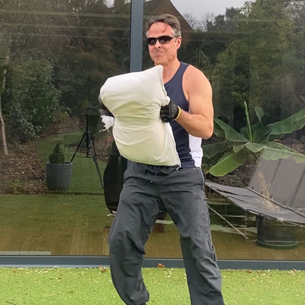 Gripping the sandbag during my workout