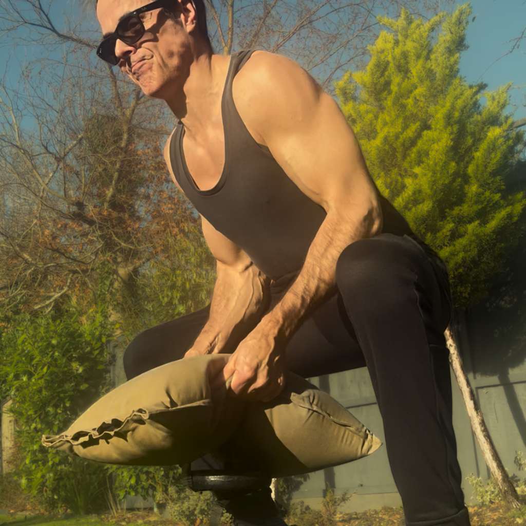 Starting a home workout in the garden with a GripSack exercise sandbag